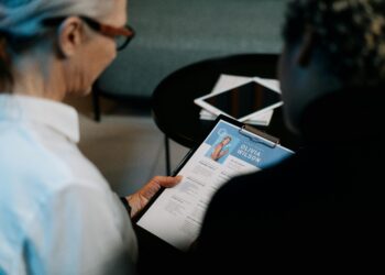 a recruiter is discussing resume with a candidate